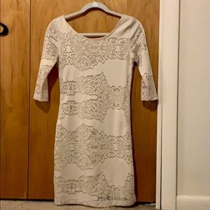 Cream open back dress with sleeves